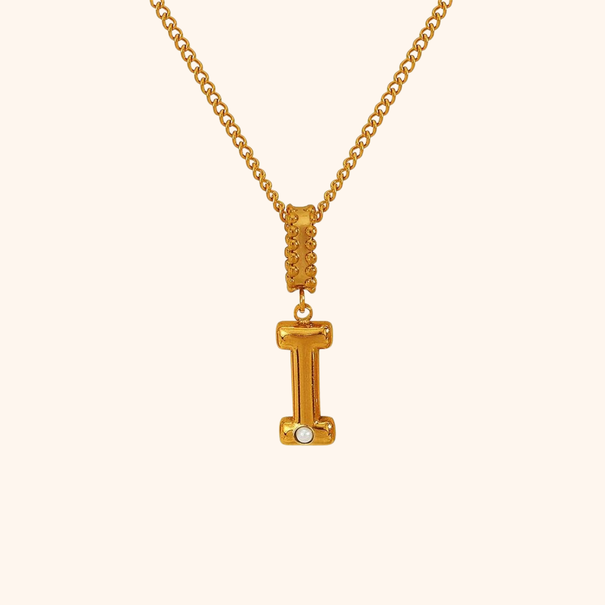 Gold-plated I initial necklace featuring a small pearl